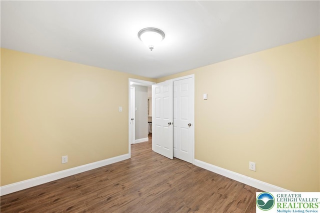 29 Long Brook Way, Penn Forest Twp, PA 18210 - unfurnished bedroom with baseboards and wood finished floors