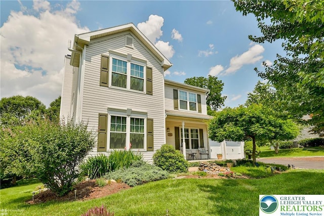 1945 Jenkins Dr, Forks Twp, PA 18040 - traditional-style house with a front lawn and covered porch
