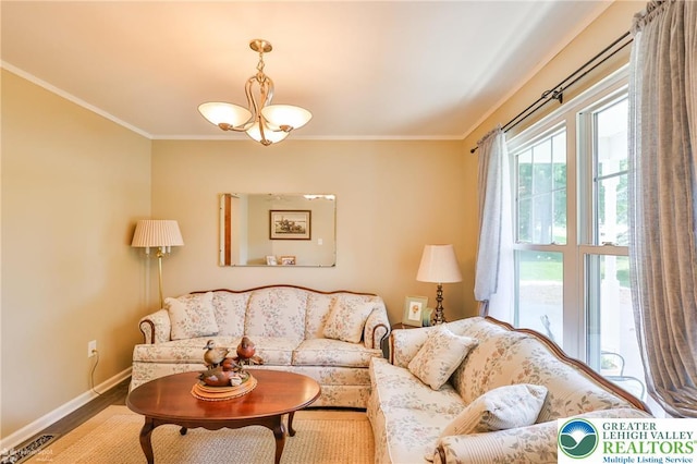 1945 Jenkins Dr, Forks Twp, PA 18040 - living room featuring a chandelier, crown molding, and wood finished floors