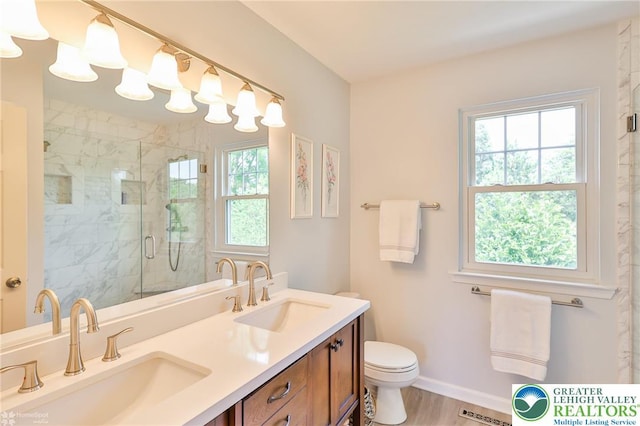 1945 Jenkins Dr, Forks Twp, PA 18040 - full bathroom with double vanity, a marble finish shower, and wood finished floors