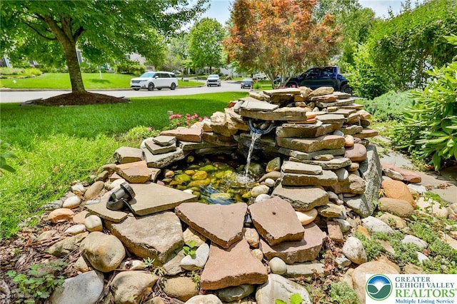 1945 Jenkins Dr, Forks Twp, PA 18040 - view of patio / terrace featuring a small pond