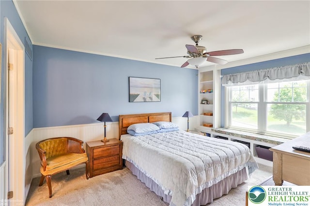 1945 Jenkins Dr, Forks Twp, PA 18040 - bedroom with wainscoting, light colored carpet, a ceiling fan, and ornamental molding