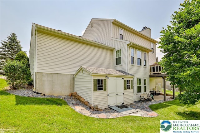 1945 Jenkins Dr, Forks Twp, PA 18040 - rear view of property with a lawn, a chimney, a patio area, and a deck