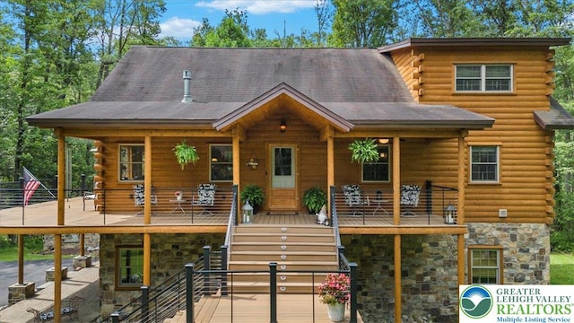 207 W Douglasville Rd, Bushkill Twp, PA 18064 - log home featuring log siding, stone siding, and a porch