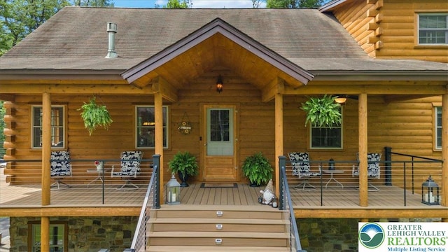 207 W Douglasville Rd, Bushkill Twp, PA 18064 - doorway to property featuring log exterior and a wooden deck