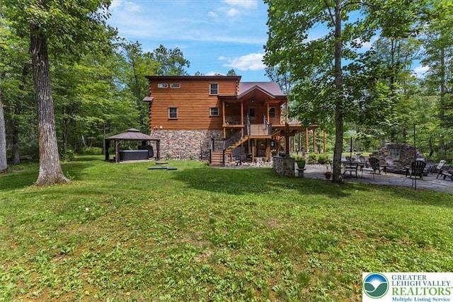 207 W Douglasville Rd, Bushkill Twp, PA 18064 - rear view of property with a gazebo, stairway, a patio area, stone siding, and a lawn