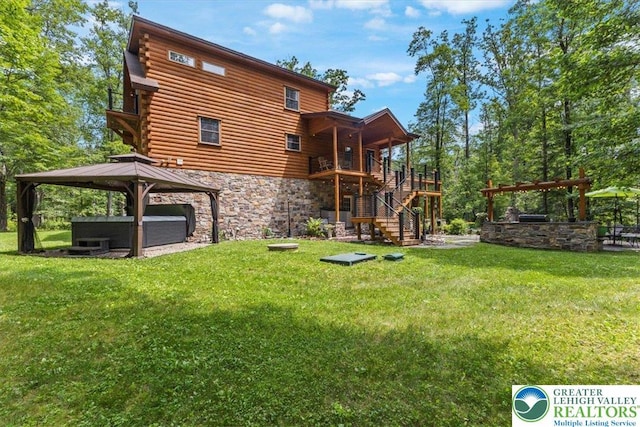 207 W Douglasville Rd, Bushkill Twp, PA 18064 - rear view of property with a gazebo, stairs, stone siding, and a lawn
