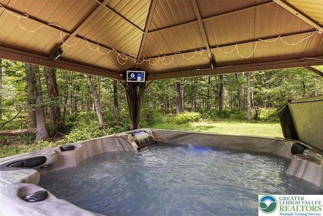 207 W Douglasville Rd, Bushkill Twp, PA 18064 - view of patio featuring a hot tub and a wooded view