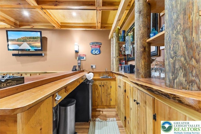 207 W Douglasville Rd, Bushkill Twp, PA 18064 - indoor wet bar with beam ceiling, light wood-type flooring, coffered ceiling, a wainscoted wall, and recessed lighting
