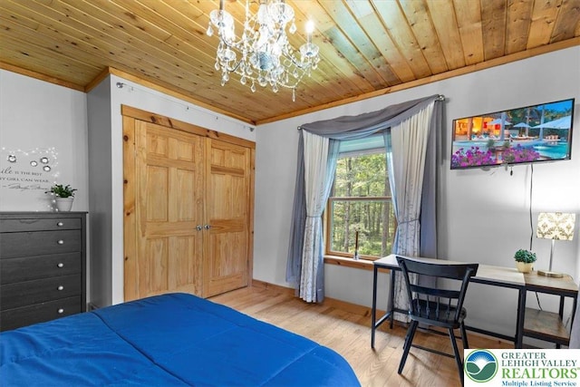 207 W Douglasville Rd, Bushkill Twp, PA 18064 - bedroom featuring a chandelier, wooden ceiling, wood finished floors, crown molding, and a closet