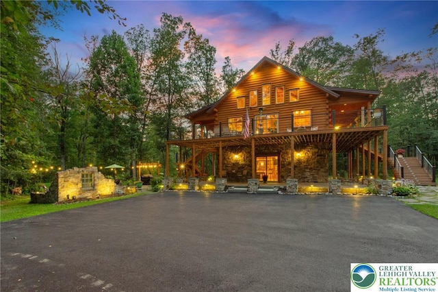 207 W Douglasville Rd, Bushkill Twp, PA 18064 - log cabin with stairway, log exterior, a wooden deck, and stone siding