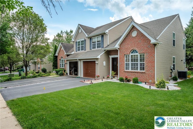 1536 Cambridge Dr, Lower Macungie Twp, PA 18062 - view of front of house featuring brick siding, a garage, driveway, a front lawn, and roof with shingles