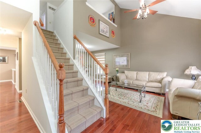 1536 Cambridge Dr, Lower Macungie Twp, PA 18062 - stairs featuring a high ceiling, wood finished floors, and a ceiling fan