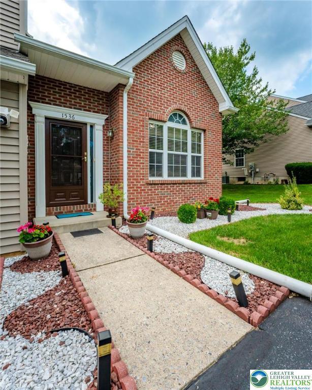 1536 Cambridge Dr, Lower Macungie Twp, PA 18062 - property entrance featuring brick siding and a lawn