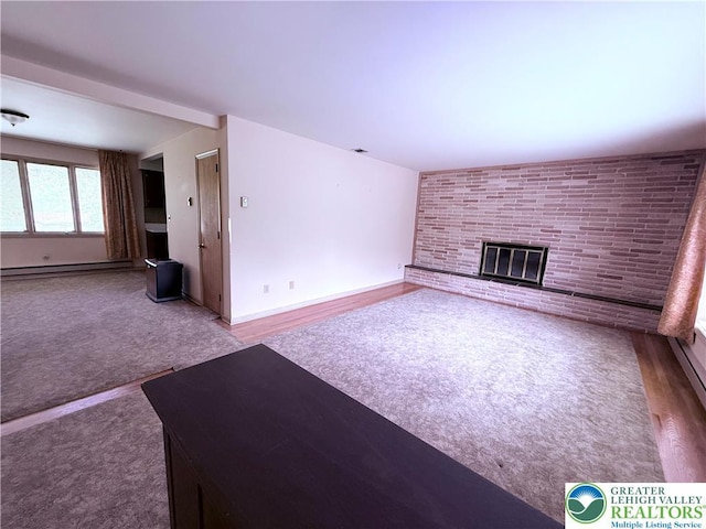 4395 E Texas Rd, Lower Macungie Twp, PA 18103 - unfurnished living room with baseboard heating, a fireplace, and carpet