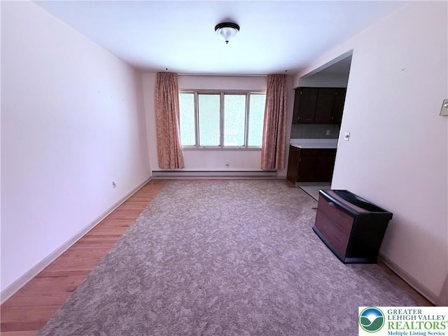 4395 E Texas Rd, Lower Macungie Twp, PA 18103 - unfurnished living room featuring a baseboard radiator and wood finished floors