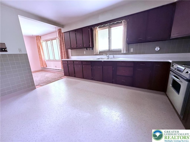 4395 E Texas Rd, Lower Macungie Twp, PA 18103 - kitchen featuring stove, healthy amount of natural light, a baseboard radiator, light countertops, and tile walls