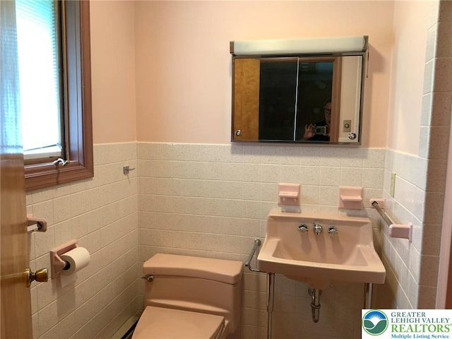 4395 E Texas Rd, Lower Macungie Twp, PA 18103 - half bathroom featuring tile walls and wainscoting
