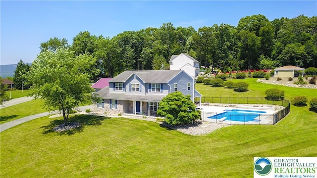7725 Harbor Ct, Washington Twp, PA 18080 - rear view of property with stone siding and covered porch