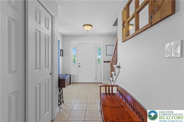 7725 Harbor Ct, Washington Twp, PA 18080 - foyer featuring light tile patterned floors and stairway