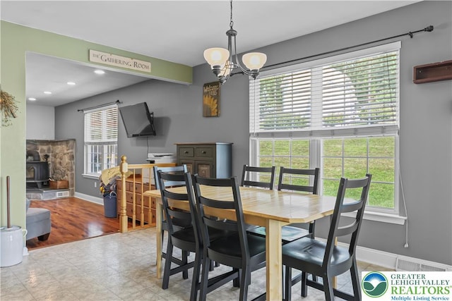 7725 Harbor Ct, Washington Twp, PA 18080 - dining area featuring a wood stove, a chandelier, plenty of natural light, and recessed lighting