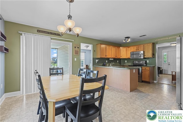 7725 Harbor Ct, Washington Twp, PA 18080 - dining space with healthy amount of natural light and a chandelier