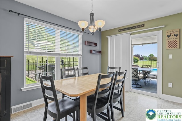 7725 Harbor Ct, Washington Twp, PA 18080 - dining space featuring a chandelier and light tile patterned floors
