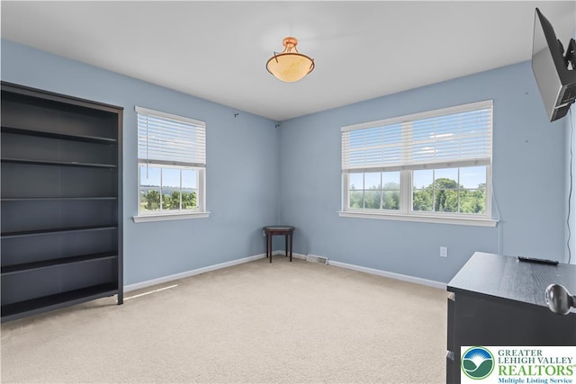 7725 Harbor Ct, Washington Twp, PA 18080 - unfurnished bedroom with multiple windows and carpet