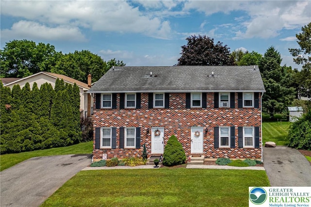 7 Rosemont Ct, Palmer Twp, PA 18045 - view of front of home with a front yard, brick siding, and roof with shingles