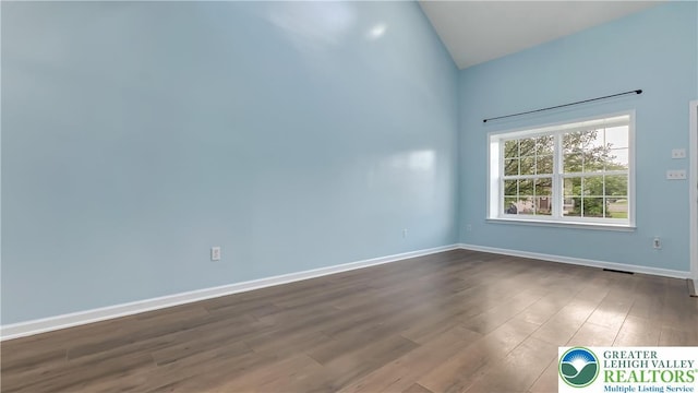 5587 Stonecroft Ln, Lower Macungie Twp, PA 18106 - unfurnished room featuring dark wood-style flooring and high vaulted ceiling