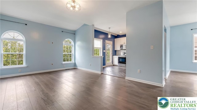 5587 Stonecroft Ln, Lower Macungie Twp, PA 18106 - unfurnished living room featuring baseboards and dark wood finished floors