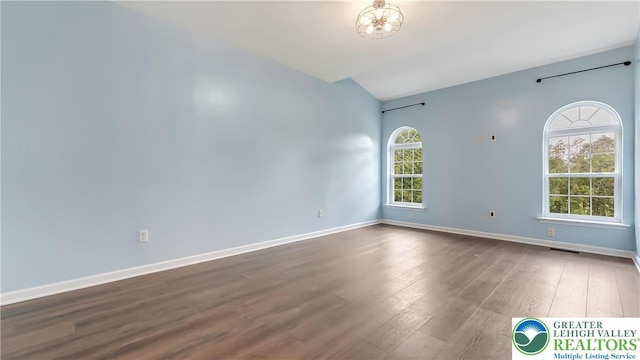 5587 Stonecroft Ln, Lower Macungie Twp, PA 18106 - spare room with dark wood-type flooring and vaulted ceiling