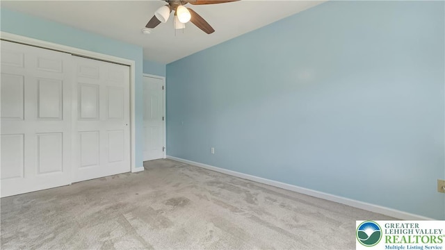 5587 Stonecroft Ln, Lower Macungie Twp, PA 18106 - unfurnished bedroom with carpet, a closet, and ceiling fan