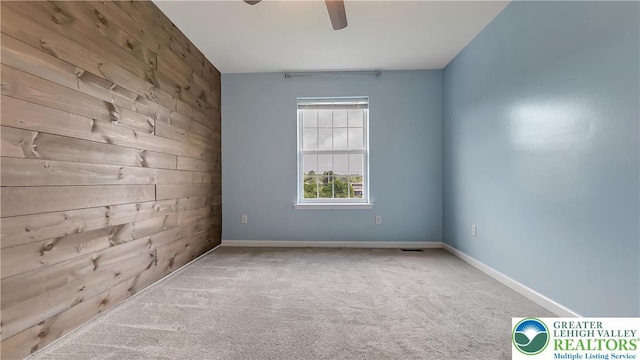 5587 Stonecroft Ln, Lower Macungie Twp, PA 18106 - carpeted empty room with ceiling fan and wooden walls