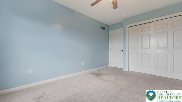 5587 Stonecroft Ln, Lower Macungie Twp, PA 18106 - unfurnished bedroom featuring carpet, a closet, and ceiling fan