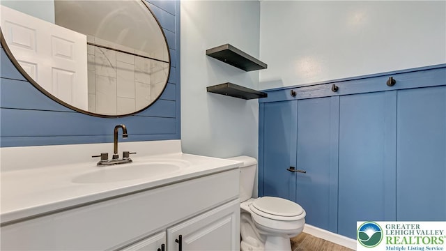 5587 Stonecroft Ln, Lower Macungie Twp, PA 18106 - bathroom featuring vanity and wood finished floors