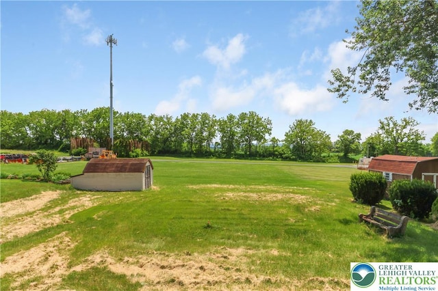5396 Nor Bath Blvd, East Allen Twp, PA 18067 - view of grassy yard with an outbuilding and view of wooded area