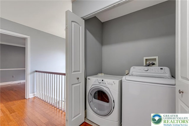 6945 Hunt Dr, Lower Macungie Twp, PA 18062 - washroom featuring separate washer and dryer and light wood finished floors