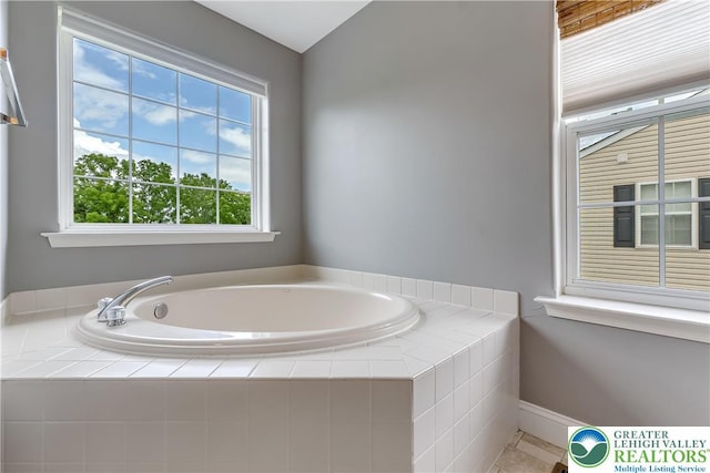 6945 Hunt Dr, Lower Macungie Twp, PA 18062 - bathroom with a garden tub and tile patterned floors