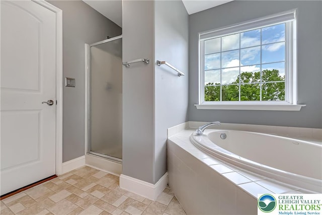 6945 Hunt Dr, Lower Macungie Twp, PA 18062 - bathroom with a stall shower, a bath, and stone finish flooring