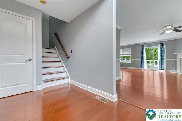 6945 Hunt Dr, Lower Macungie Twp, PA 18062 - staircase featuring a ceiling fan and wood finished floors