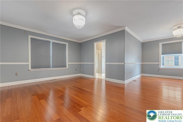 6945 Hunt Dr, Lower Macungie Twp, PA 18062 - empty room with a chandelier, wood-type flooring, and ornamental molding