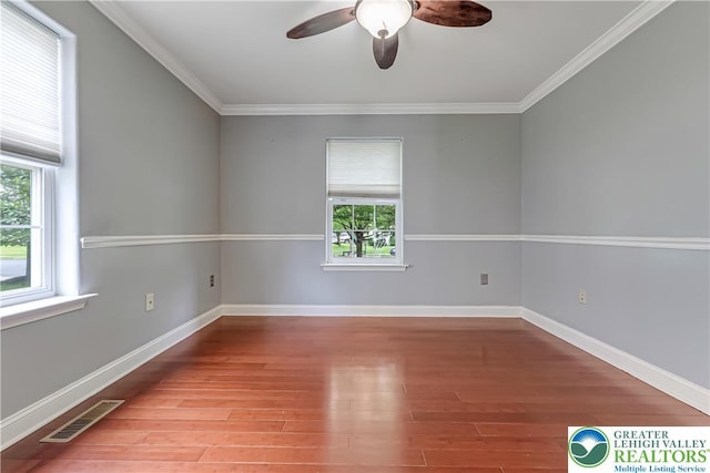 6945 Hunt Dr, Lower Macungie Twp, PA 18062 - empty room featuring a ceiling fan, wood finished floors, and ornamental molding