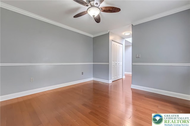 6945 Hunt Dr, Lower Macungie Twp, PA 18062 - unfurnished room featuring ceiling fan, wood finished floors, and crown molding