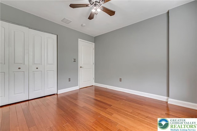 6945 Hunt Dr, Lower Macungie Twp, PA 18062 - unfurnished bedroom featuring light wood finished floors, a closet, and ceiling fan