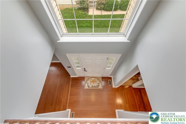 6945 Hunt Dr, Lower Macungie Twp, PA 18062 - foyer with a towering ceiling and wood finished floors