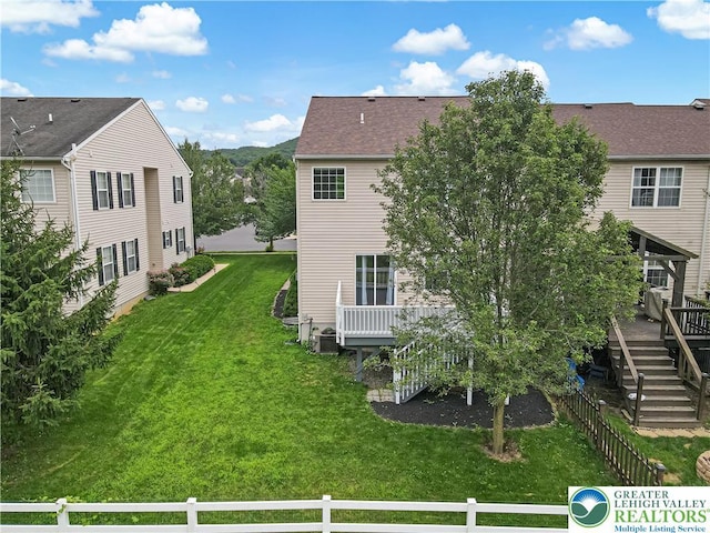 6945 Hunt Dr, Lower Macungie Twp, PA 18062 - rear view of property with a wooden deck and stairway