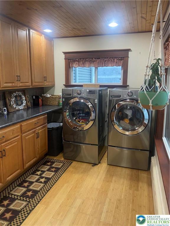733 Nazareth Pike, Lower Nazareth Twp, PA 18064 - washroom featuring cabinet space, light wood finished floors, wooden ceiling, and washer and dryer