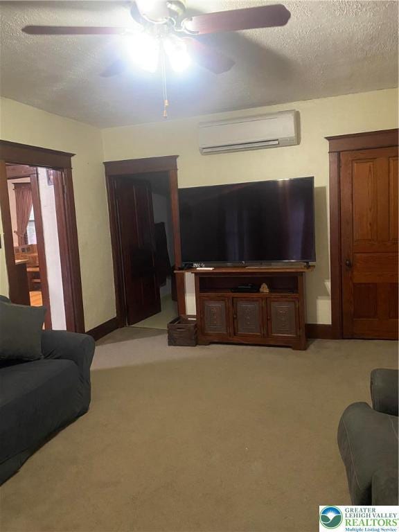 733 Nazareth Pike, Lower Nazareth Twp, PA 18064 - living room featuring a wall mounted air conditioner, a ceiling fan, a textured ceiling, and light carpet
