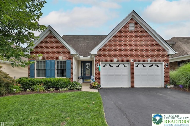 4076 Pine Hurst Dr, Allen Twp, PA 18067 - traditional-style house featuring brick siding, driveway, a garage, and a front yard